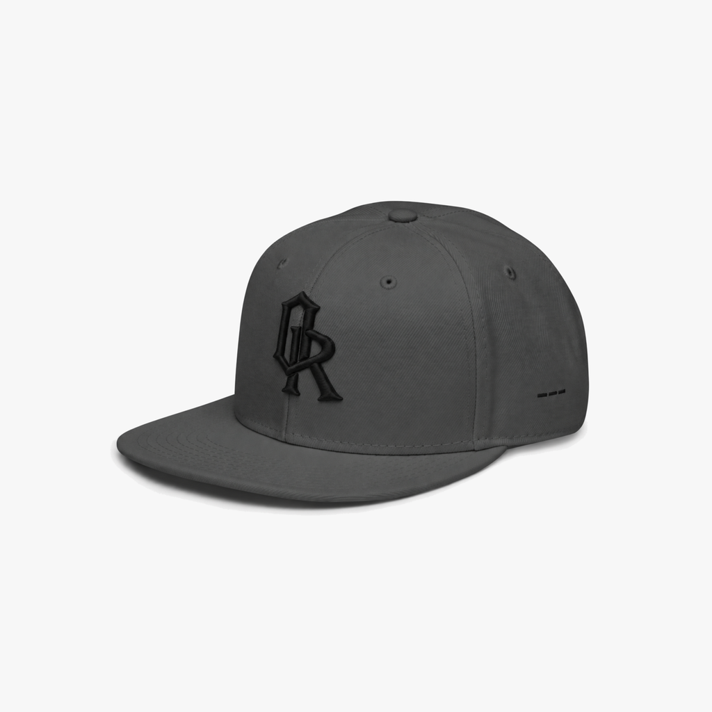 Charcoal grey snapback cap with a black embroidered 'OR' logo on the front, set against a plain light gray background.