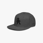 Charcoal grey snapback cap with a black embroidered 'OR' logo on the front, set against a plain light gray background.