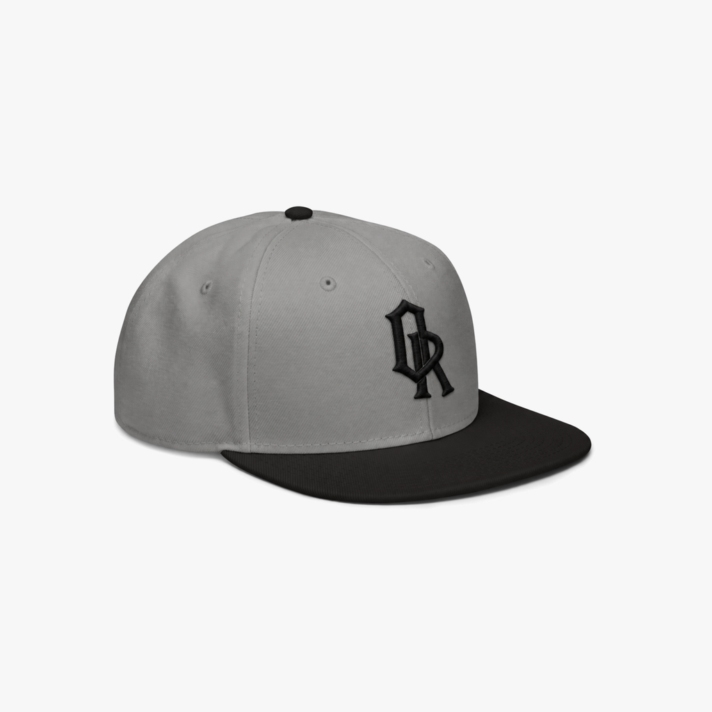 Grey and black snapback cap with a black embroidered 'OR' logo on the front, set against a plain light gray background.