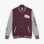 A varsity-style jacket with a burgundy body and heather gray sleeves, featuring a white and burgundy 'OR' logo on the left chest, black script embroidery on the right sleeve, and striped ribbed trim.