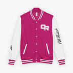 A varsity-style jacket with a bright magenta pink body and white sleeves, featuring a white and pink 'OR' logo on the left chest, a black script signature on the right sleeve, and pink and white striped ribbed trim.
