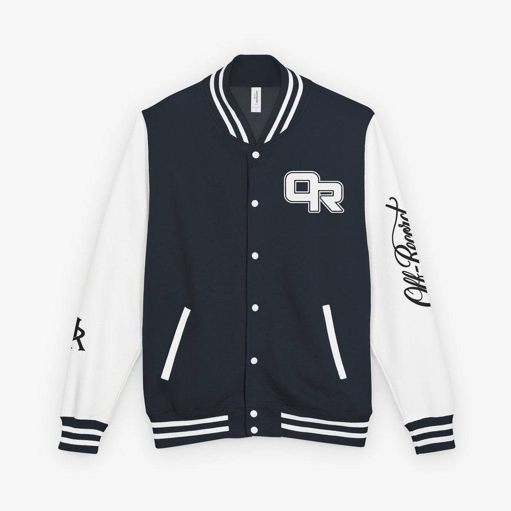 A black and white varsity jacket with a black and white striped ribbed collar, cuffs, and hem. The front has a black body with white buttons, a white 'OR' logo on the left chest, and a black script logo on the right sleeve.