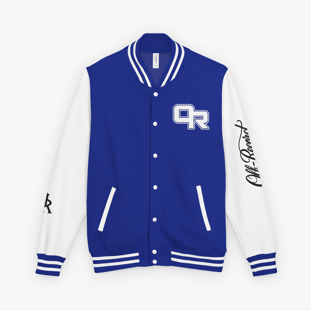 A purple and white varsity jacket with a purple front panel, white sleeves, and a purple and white 'OR' logo on the left chest. It features white ribbed trim on the collar, cuffs, and hem, and a black script signature on the right sleeve.