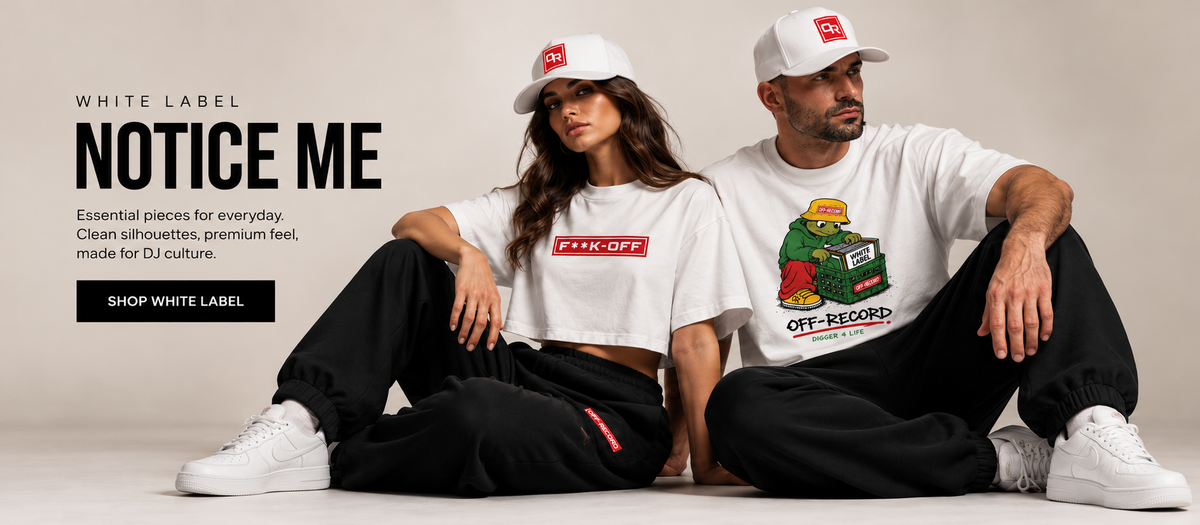 White Label. Notice Me. Essential pieces for everyday. Clean silhouettes, premium feel, made for DJ culture. A woman and a man sit on a studio floor in white Off-Record T-shirts, caps and black joggers.