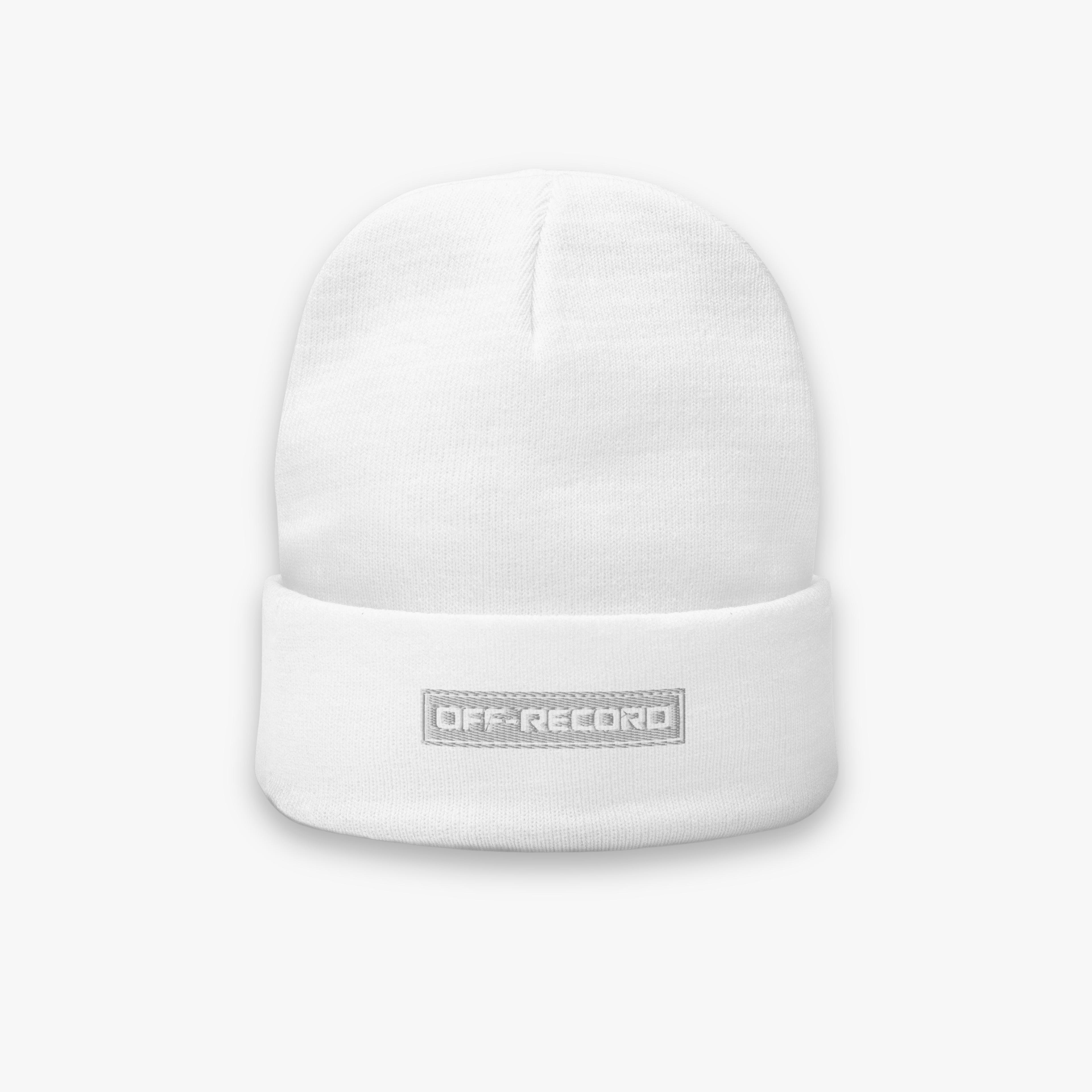 A white knit cuffed beanie hat featuring a gray rectangular patch on the front cuff with the text 'OFF-RECORD' in white, set against a light gray background.